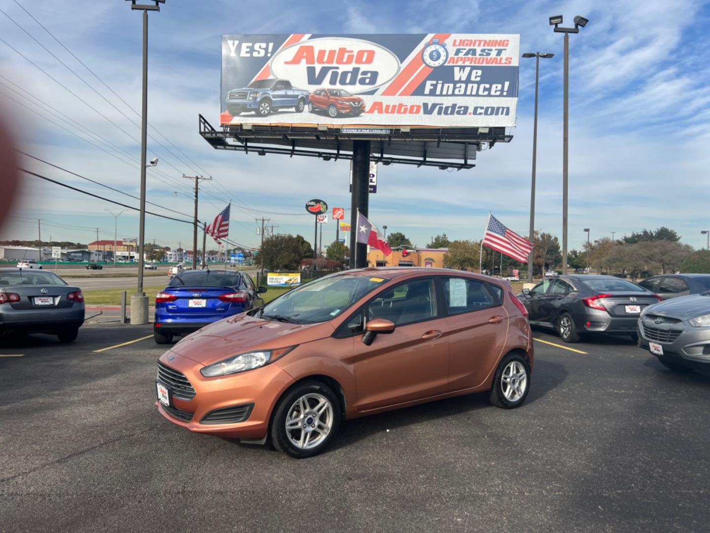 2017 ORANGE Ford Fiesta SE Hatchback (3FADP4EJ0HM) with an 1.6L L4 DOHC 16V engine, located at 420 I-35E, Lancaster, TX, 75146, (469) 297-4144, 32.593929, -96.823685 - Photo#0